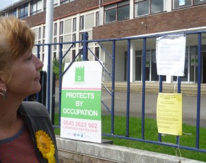 Meri outside the closed up Elvian School site